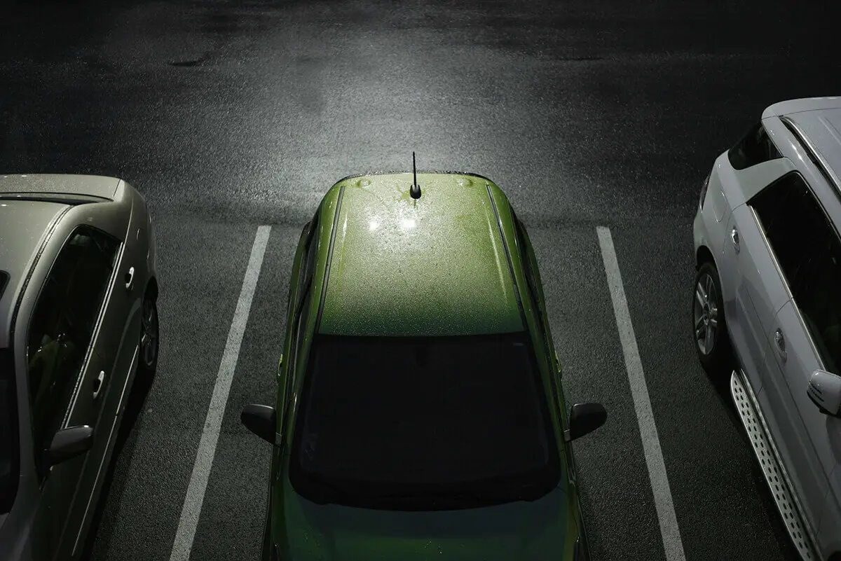 Cars in Parking Lot Night Time - background image